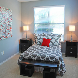 Bedroom of 2 bedroom apartment home model with lots of natural light and modern furnishings