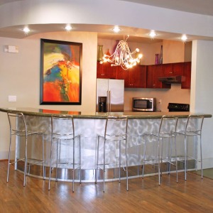 Kitchen area of resident function space with stainless steel appliances
