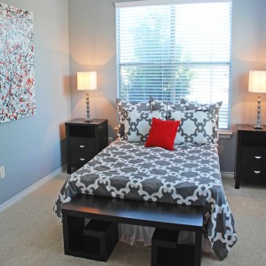 Bedroom of 2 bedroom apartment home model with lots of natural light and modern furnishings