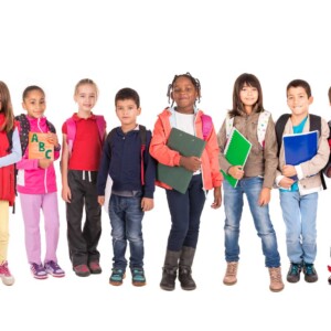 kids holding school books smiling